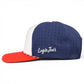 Sure! Here’s a rewritten sentence using the provided product data: The Freedom Flight Golf Hat by Logie Joe’s Golf is an American-style adjustable snapback cap in red, white, and blue, featuring an embroidered side logo, perforated blue panels, a red brim with braided trim, and a built-in magnetic ball marker holder with marker included.