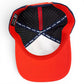 A top-down view of the inside of the Logie Joe’s Golf Freedom Flight Golf Hat—a red, white, and blue snapback cap—showing the tags, polka dot lining, and the phrase MAKE YOUR MARK on the inner band. This premium golf hat features thoughtful American-inspired details like a built-in magnetic ball marker holder with a marker included.