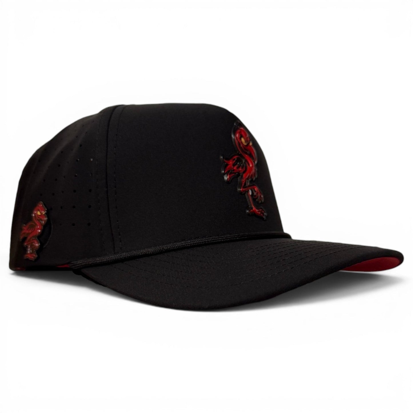 A stylish black snapback from Logie Joe’s Golf, the Jogie Loe’s Flamingo Golf Hat features an embroidered red and black rooster on the front and side. Designed with a built-in magnetic ball marker holder (marker included), this adjustable hat is displayed on a white background.