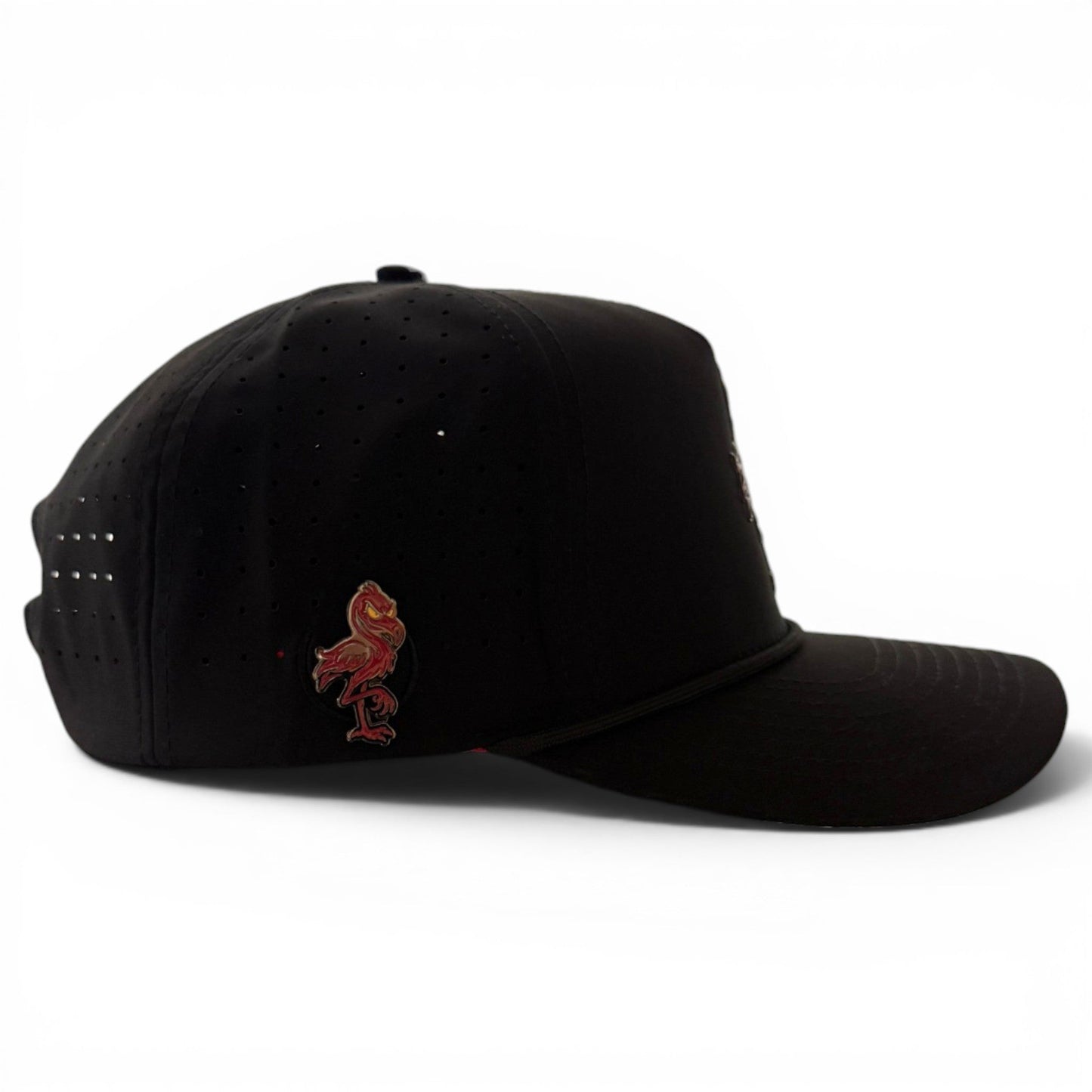 A black Jogie Loe’s Flamingo Golf Hat by Logie Joe’s Golf, featuring small ventilation holes, an adjustable snapback design, a built-in magnetic ball marker holder with marker included, and a red flamingo emblem on the side, photographed against a white background.