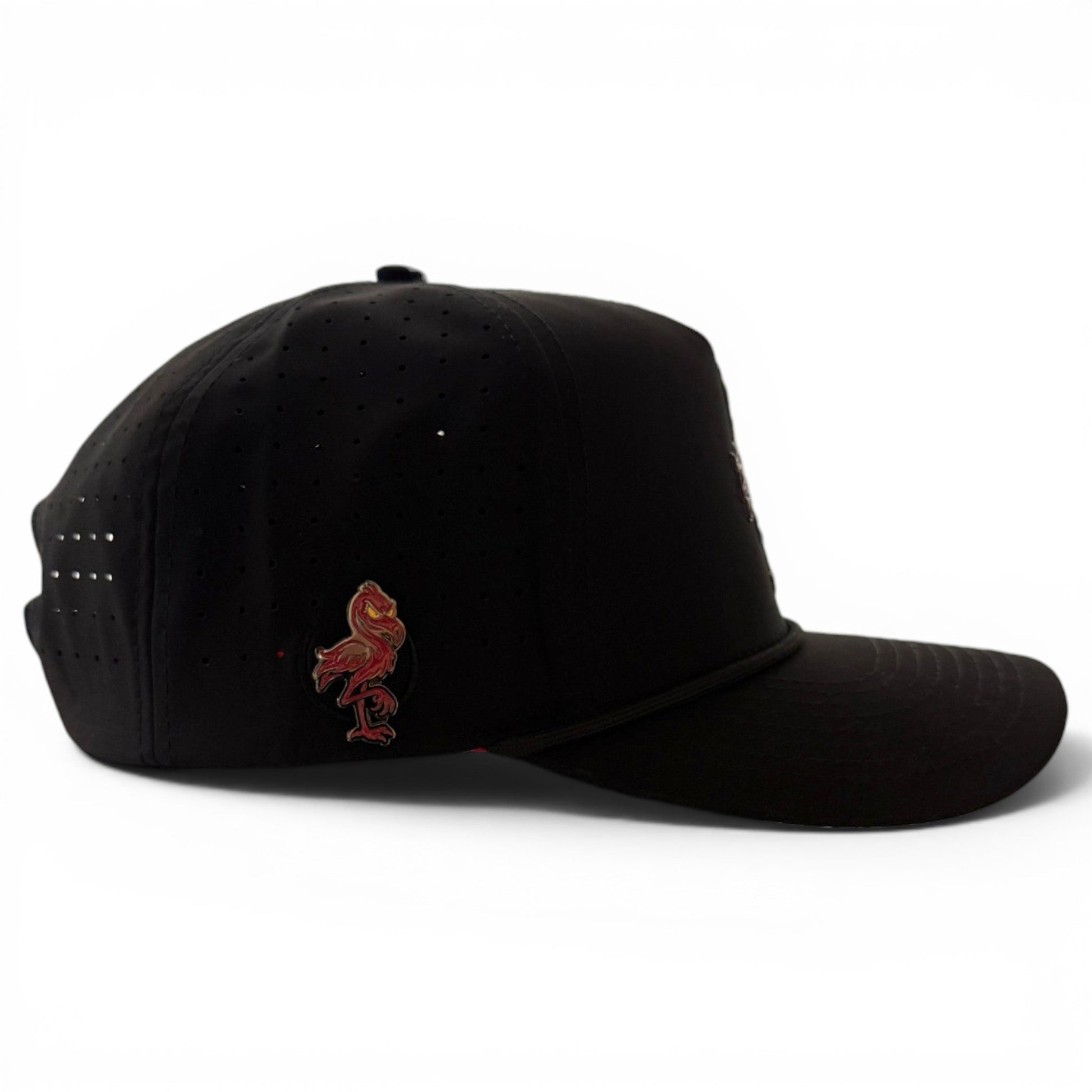 A black Jogie Loe’s Flamingo Golf Hat by Logie Joe’s Golf, featuring small ventilation holes, an adjustable snapback design, a built-in magnetic ball marker holder with marker included, and a red flamingo emblem on the side, photographed against a white background.