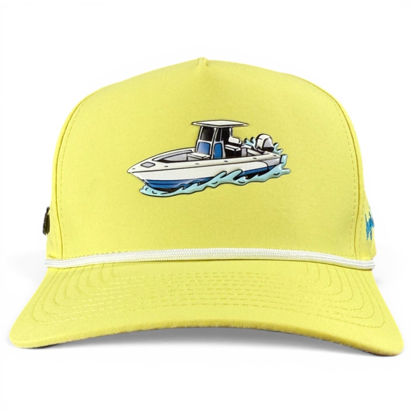 Check out the Motor Boatin’ Golf Hat from Logie Joe’s Golf—a yellow snapback cap featuring a white and blue speedboat on water illustrated on the front panel, accented by a white cord above the brim. This stylish hat includes an adjustable fit, a built-in magnetic ball marker holder with marker, and is perfect for any golf enthusiast.