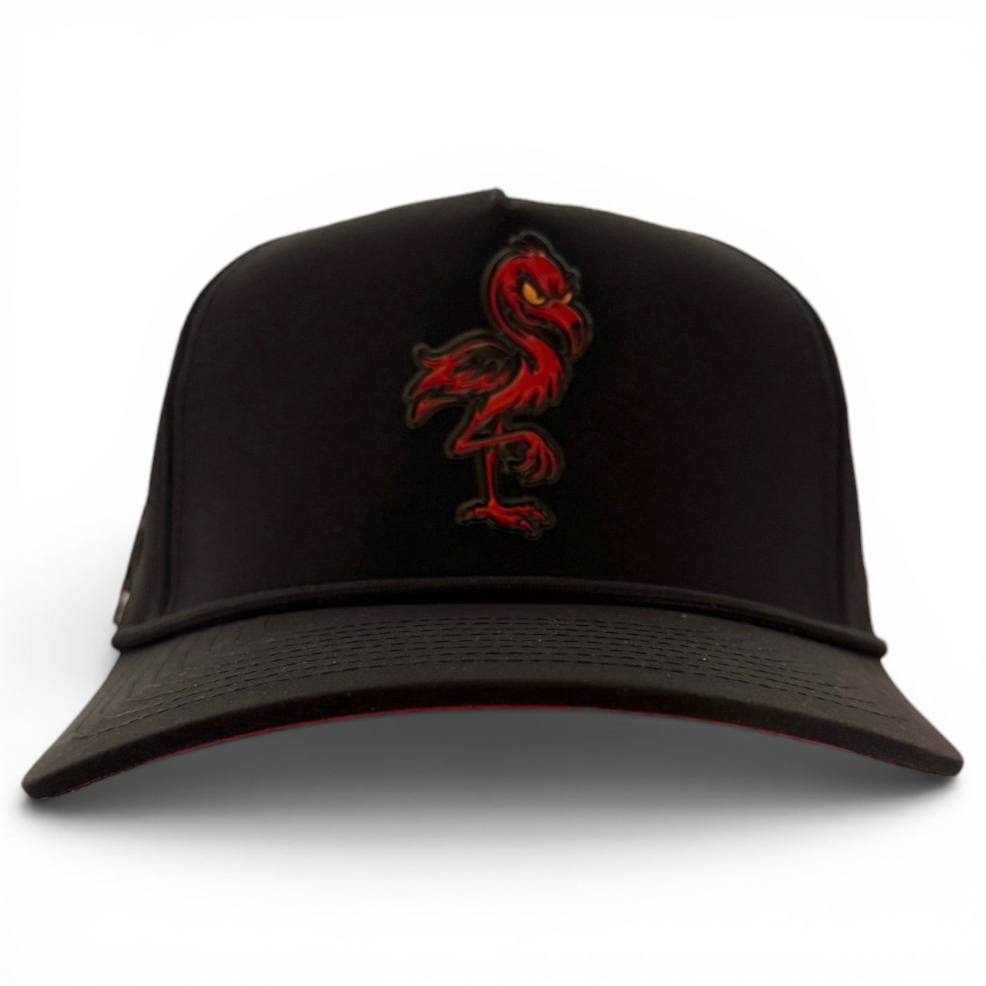 Introducing the Jogie Loe’s Flamingo Golf Hat by Logie Joe’s Golf—a black adjustable snapback cap showcasing an embroidered red flamingo logo on the front. Displayed against a white background, this stylish golf hat features a built-in magnetic ball marker holder with marker included for added convenience on the course.