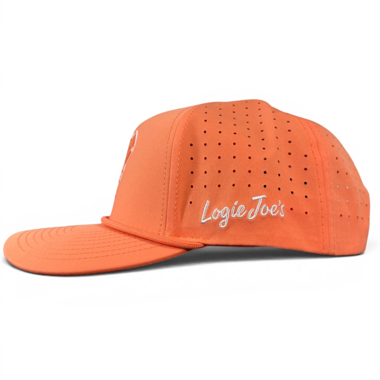 Introducing the Orange Dream Golf Hat by Logie Joe’s Golf: this adjustable orange snapback cap features small ventilation holes and “Logie Joe’s” embroidered in white on the side. Designed for style and practicality on the course, it includes a built-in magnetic ball marker holder with marker included, keeping your game essentials conveniently within reach.