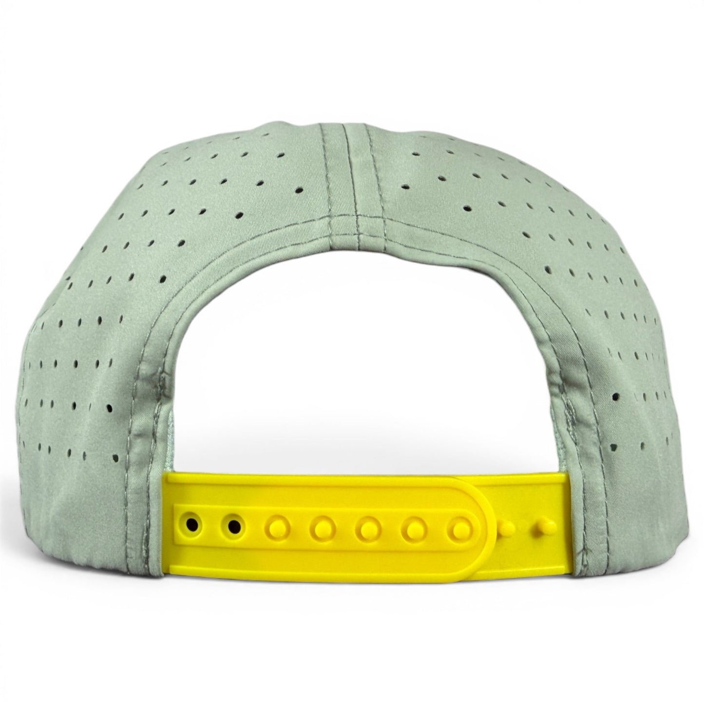 A light gray Logie Joe’s Golf Angelfish Golf Hat snapback cap, shown from the back, featuring small ventilation holes and an adjustable yellow plastic strap. This cap includes a built-in magnetic ball marker holder and comes with a marker.