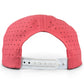 A Logie Joe’s Golf Redfoot Birdie Golf Hat, a vibrant red snapback cap featuring built-in magnetic ball marker holder and included marker, is shown from the back, displaying its white adjustable plastic strap with multiple holes.