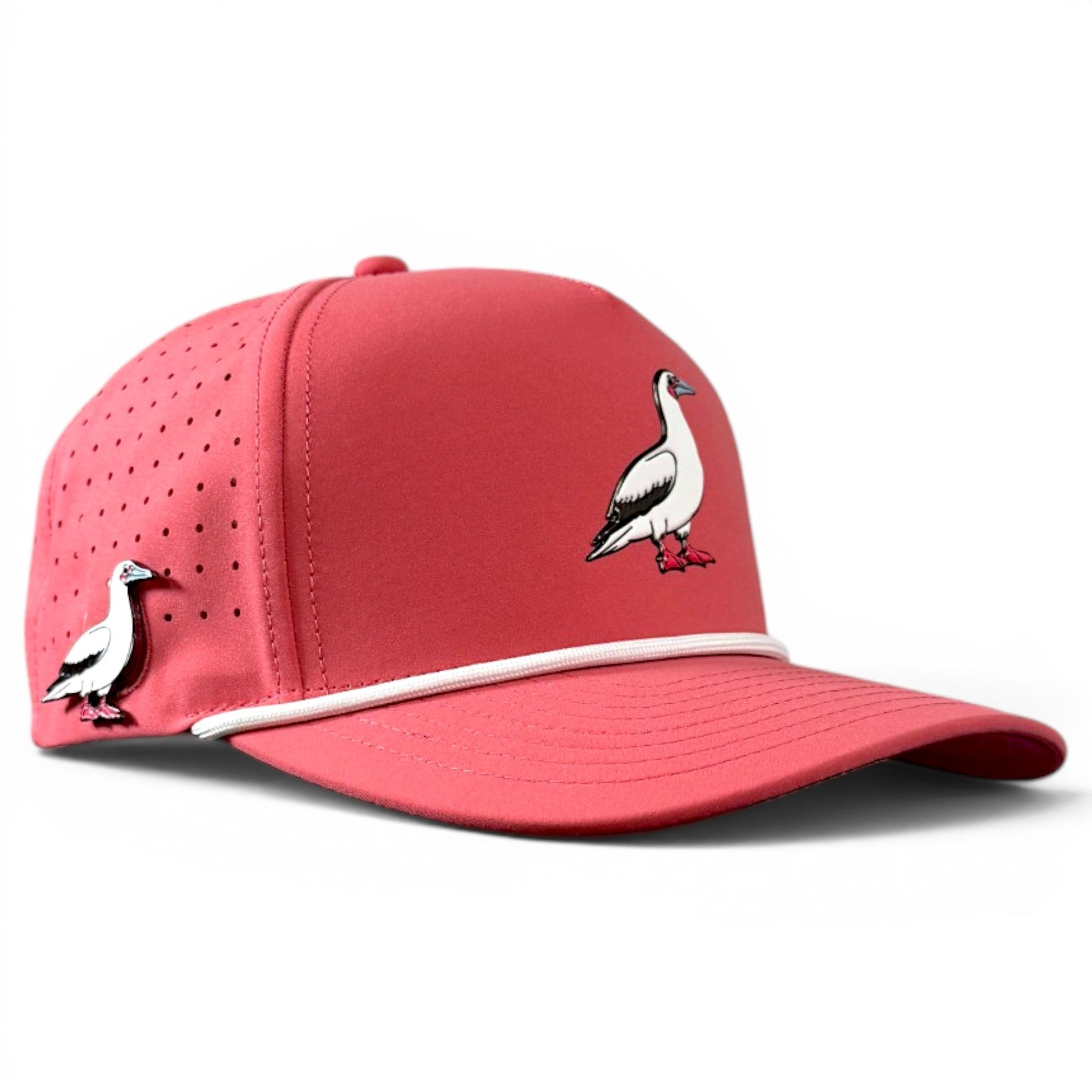 Introducing the Logie Joe’s Golf Redfoot Birdie Golf Hat, a stylish red snapback cap featuring an illustration of a white and black Red-footed Booby with orange feet on the front and side, complemented by a white accent cord above the brim. This adjustable hat is designed for golf enthusiasts, offering both unique style and functionality with its built-in magnetic ball marker holder and included marker.
