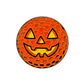 The Jack-o'-lantern Golf Ball Ball Marker by Ballmarkers.com is a round orange marker with black and orange dots, featuring a carved smiling face and triangular eyes. The item is shown against a plain white background.