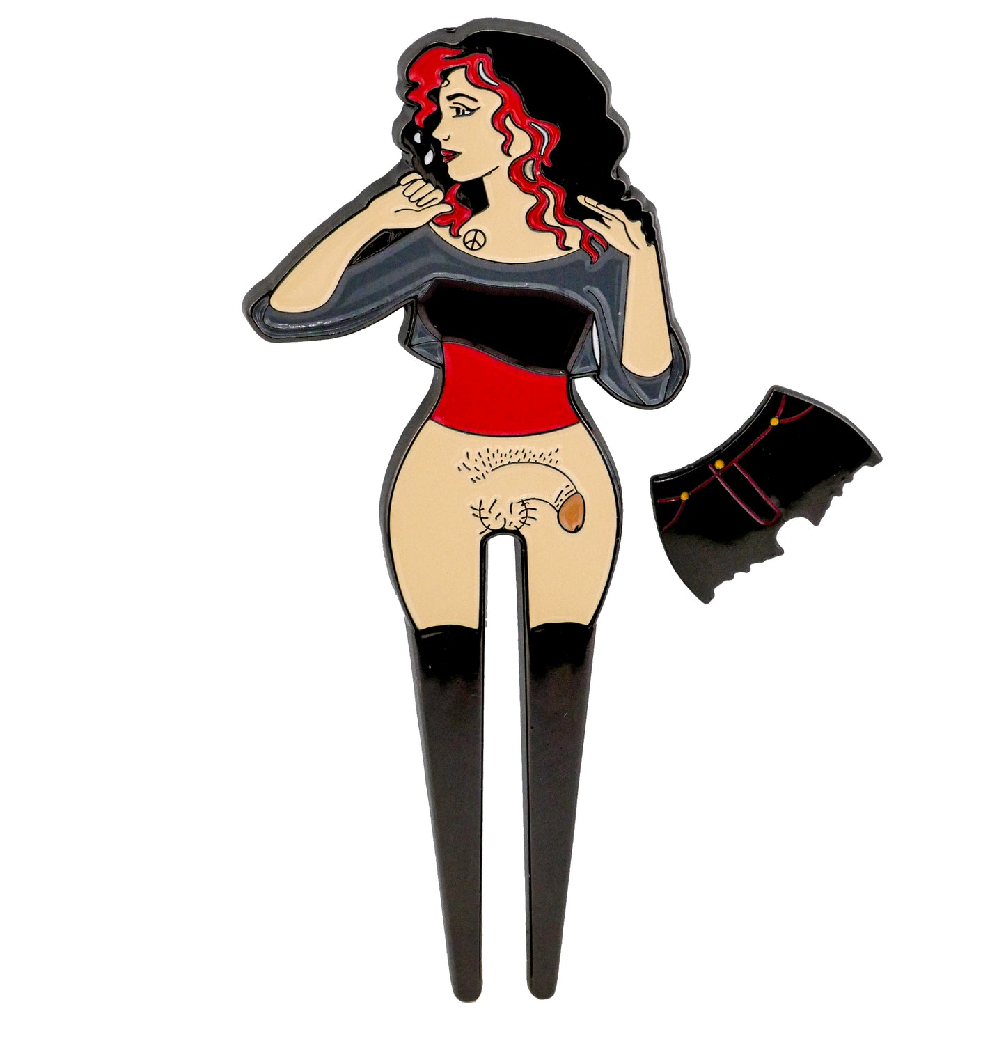 The NSFW Lady Surprise Divot Tool by Bunkers & Rough is a unique enamel golf accessory featuring a woman with black and red hair; her skirt’s removable ball marker reveals a tattoo-style cat on her thigh.