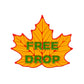The Free Drop Leaf Ball Marker by Ballmarkers.com is an orange, leaf-shaped golf ball marker with red edges and bold green "FREE DROP" text—ideal for the course.