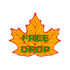 The Free Drop Leaf Ball Marker by Ballmarkers.com is an orange, leaf-shaped golf ball marker with red edges and bold green "FREE DROP" text—ideal for the course.