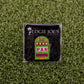 A square pin from Ballmarkers by Logie Joes, featuring a colorful slot machine and “LOGIE JOE’S” on black—perfect as a unique golf ball marker or a fun gift for fans of quirky golf accessories.