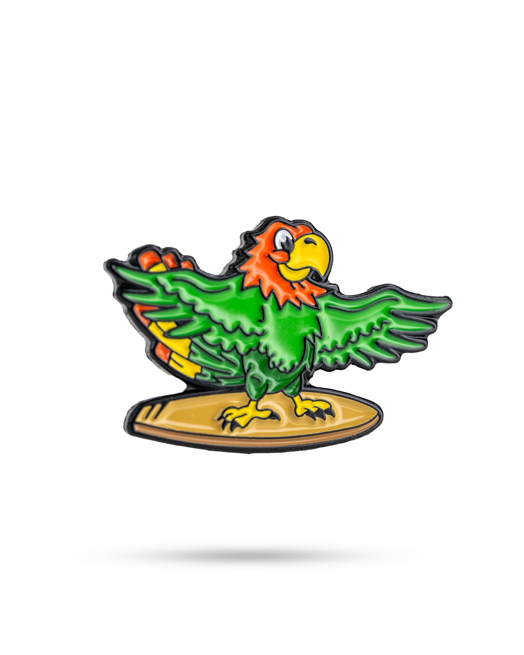 The Margaritaville - Surfing Parrot Ball Marker by Pins and Aces features a vibrant cartoon parrot with green wings, an orange head, and a yellow beak standing on a surfboard—great for golf accessory fans.