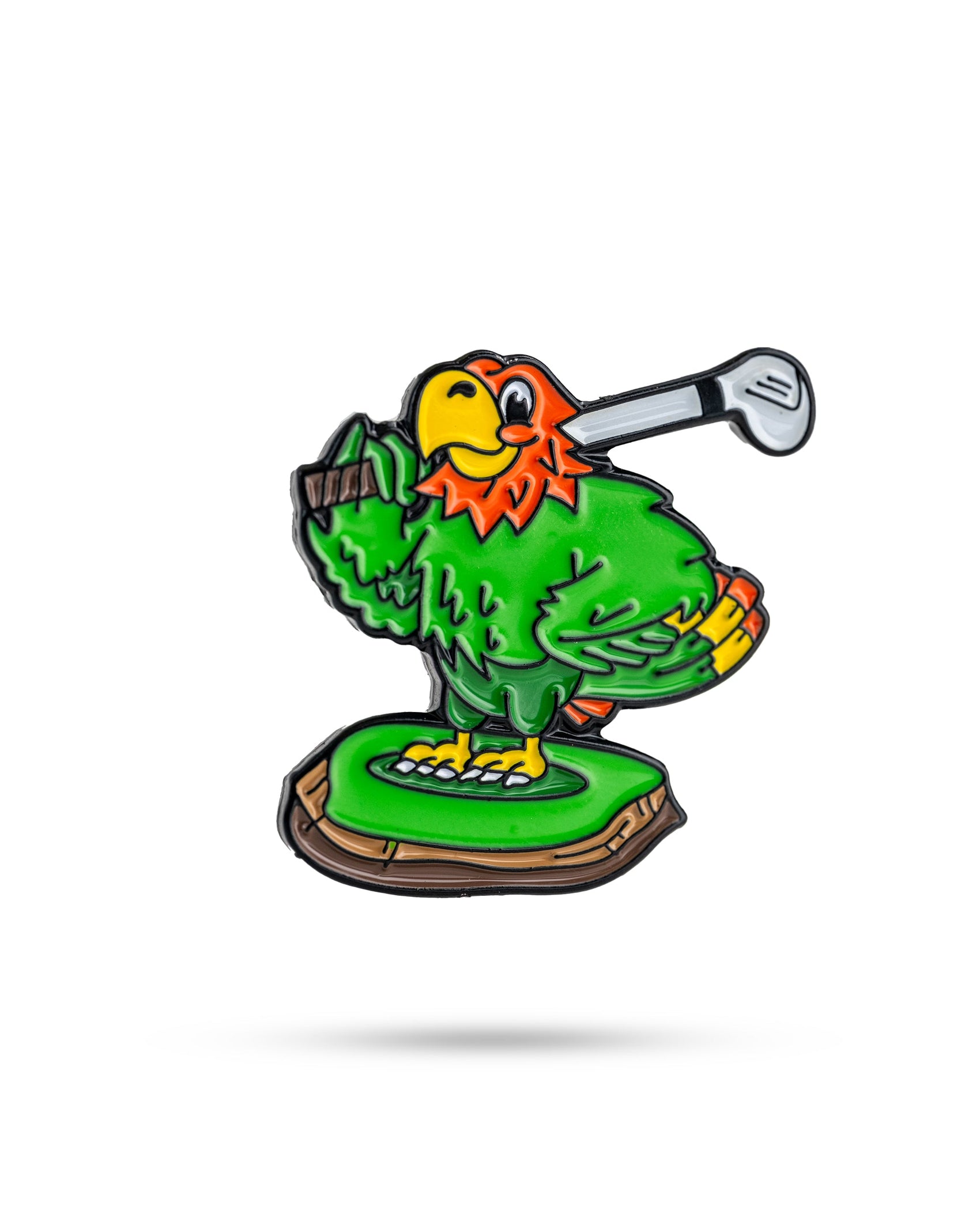 The Margaritaville - Golfing Parrot Ball Marker by Pins and Aces features a colorful green parrot with an orange chest and yellow beak, standing on a small green platform, golf club over its shoulder, ready to swing.