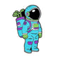 The Ballmarkers.com Astronaut Space Walker Ball Marker features a cartoon astronaut in a blue and purple suit with a reflective black visor and a backpack sprouting green plants, standing upright on a white background.