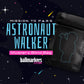 A black resealable bag featuring a dotted outline of an astronaut surrounded by stars, set against a space-themed background. The text reads: Astronaut Walker Mystery Blind Bag by Ballmarkers.com. Perfect for any golf ball marker enthusiast.