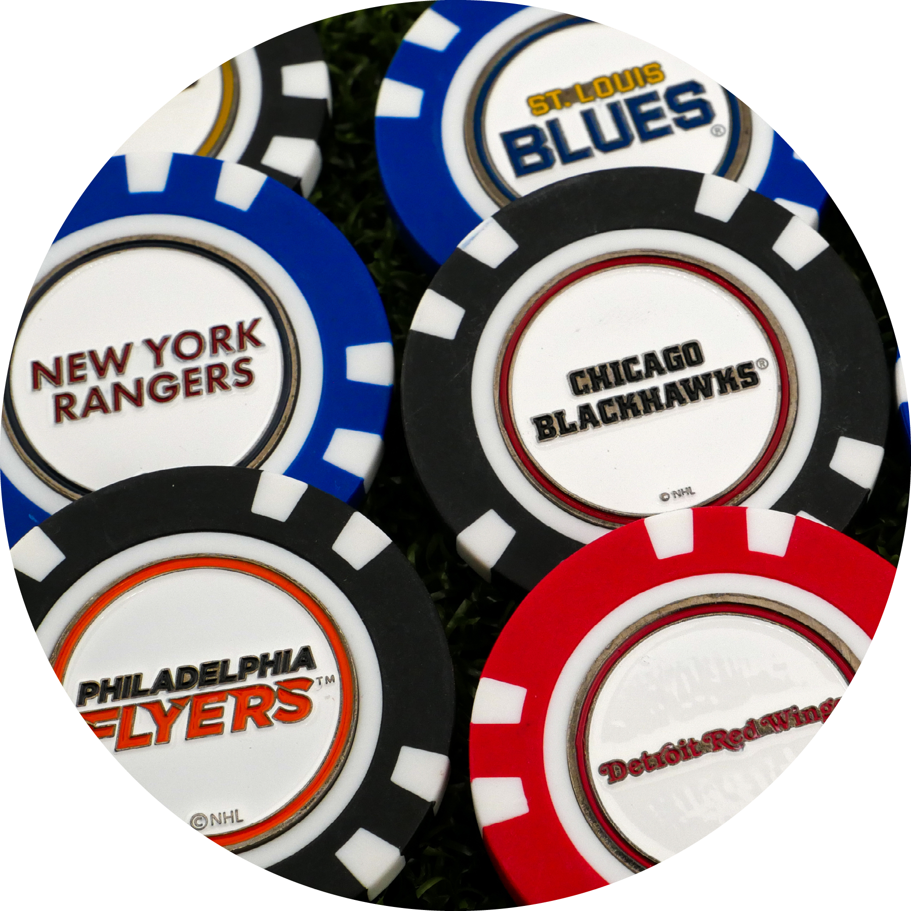 NHL Team Ball Markers by NHL, featuring logos of the St. Louis Blues, Chicago Blackhawks, New York Rangers, Philadelphia Flyers, and Detroit Red Wings, are displayed closely together on a surface.