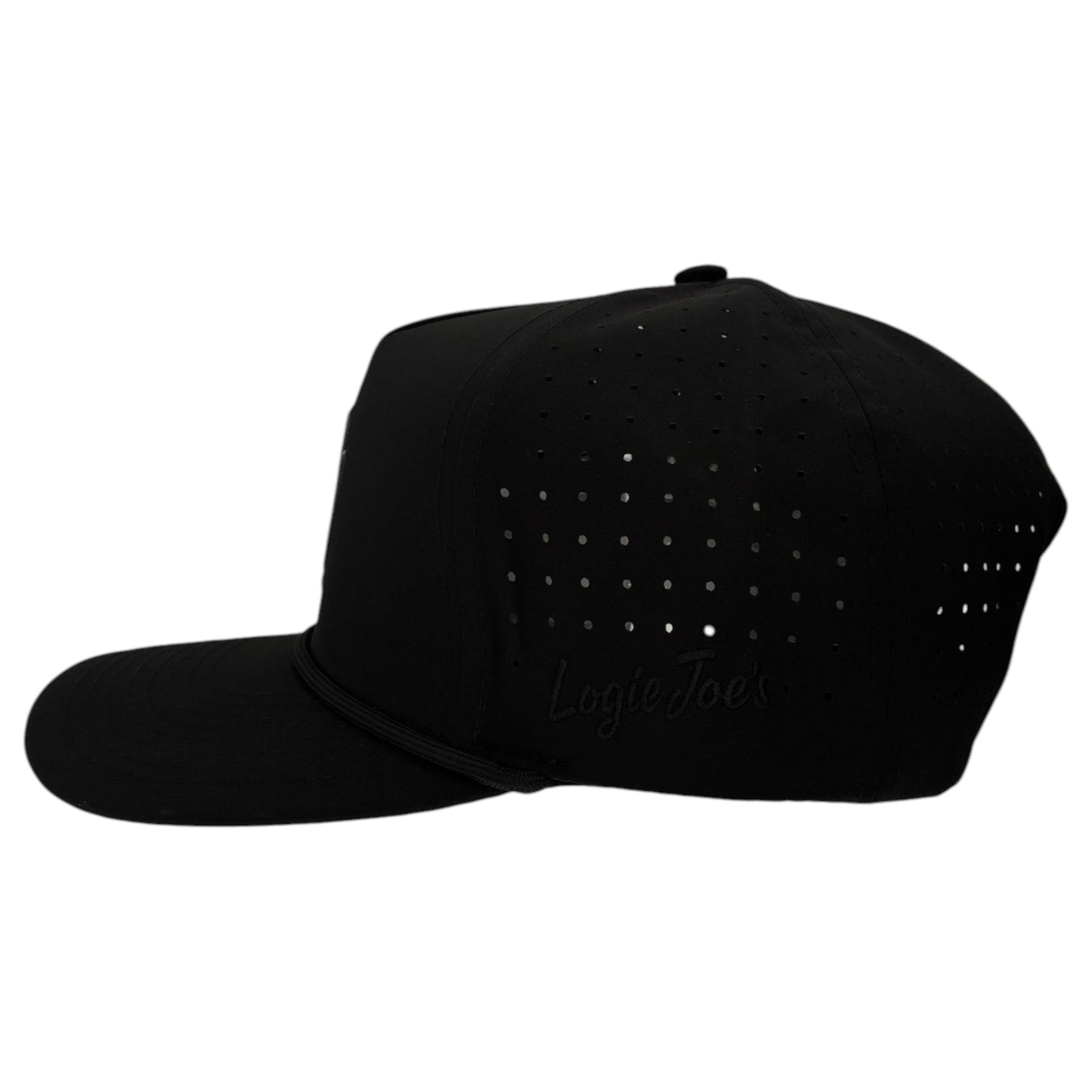 The Logie Joe's Golf Night Stalker Golf Hat is a black snapback cap with animal eyes, flat brim, ventilation holes, subtle embossed text, and a built-in magnetic ball marker holder with marker included for added convenience on the course.