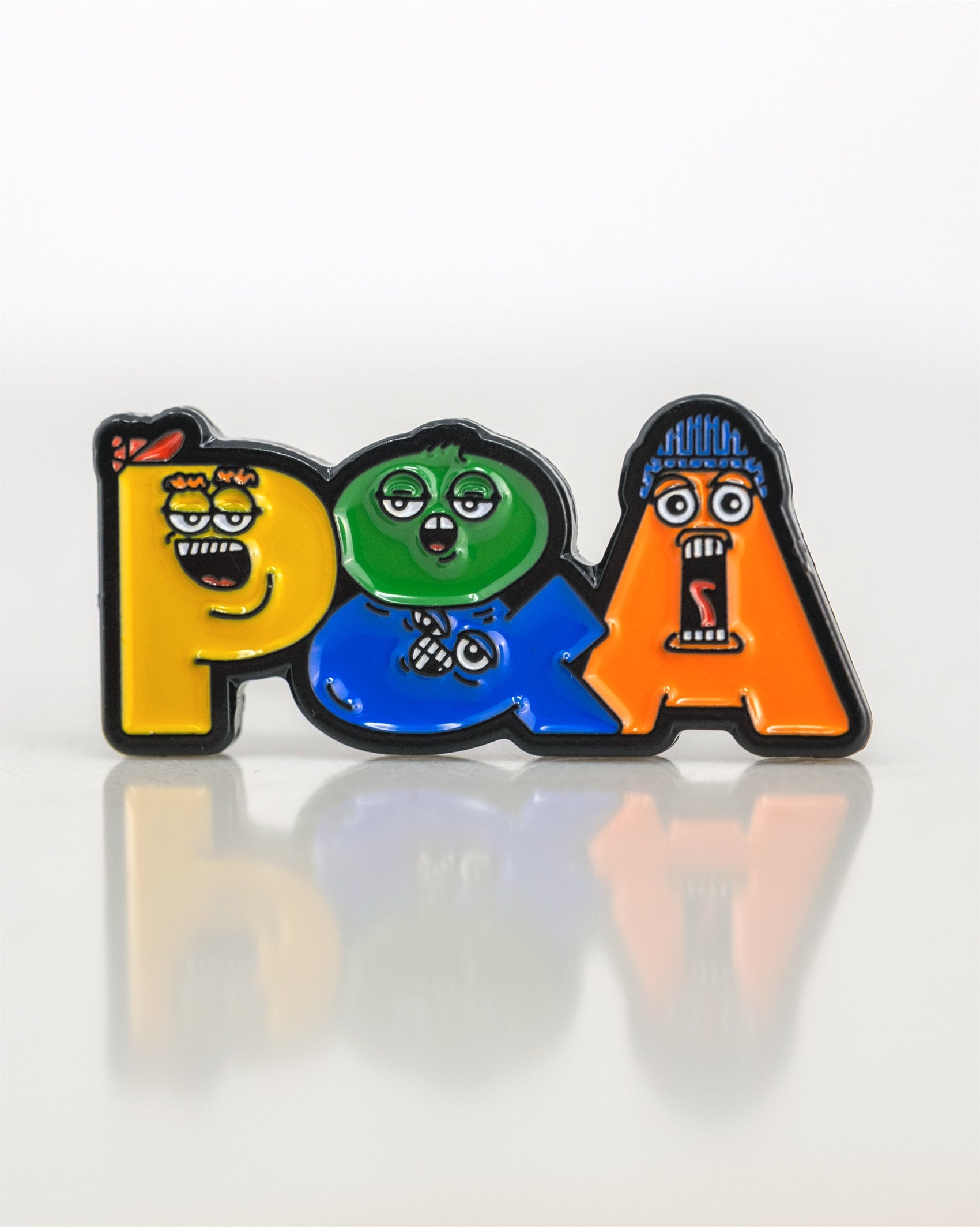 The Pins and Aces P&A Buddies Ball Marker features colorful enamel letters, each with a unique cartoon face in yellow, green, and orange. Its reflective white background is perfect for displaying on any magnetic surface.