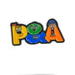 The P&A Buddies Ball Marker by Pins and Aces features colorful, cartoon-style PQA letters with animated faces on each letter, set against a white background with a subtle shadow below—each letter looks as if crafted from enamel paint.