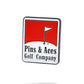 The Pins and Aces Reds Ball Marker is a rectangular enamel pin with a red flag on white above "Pins & Aces Golf Company" in black, featuring durable enamel paint and a classic golf-themed design.
