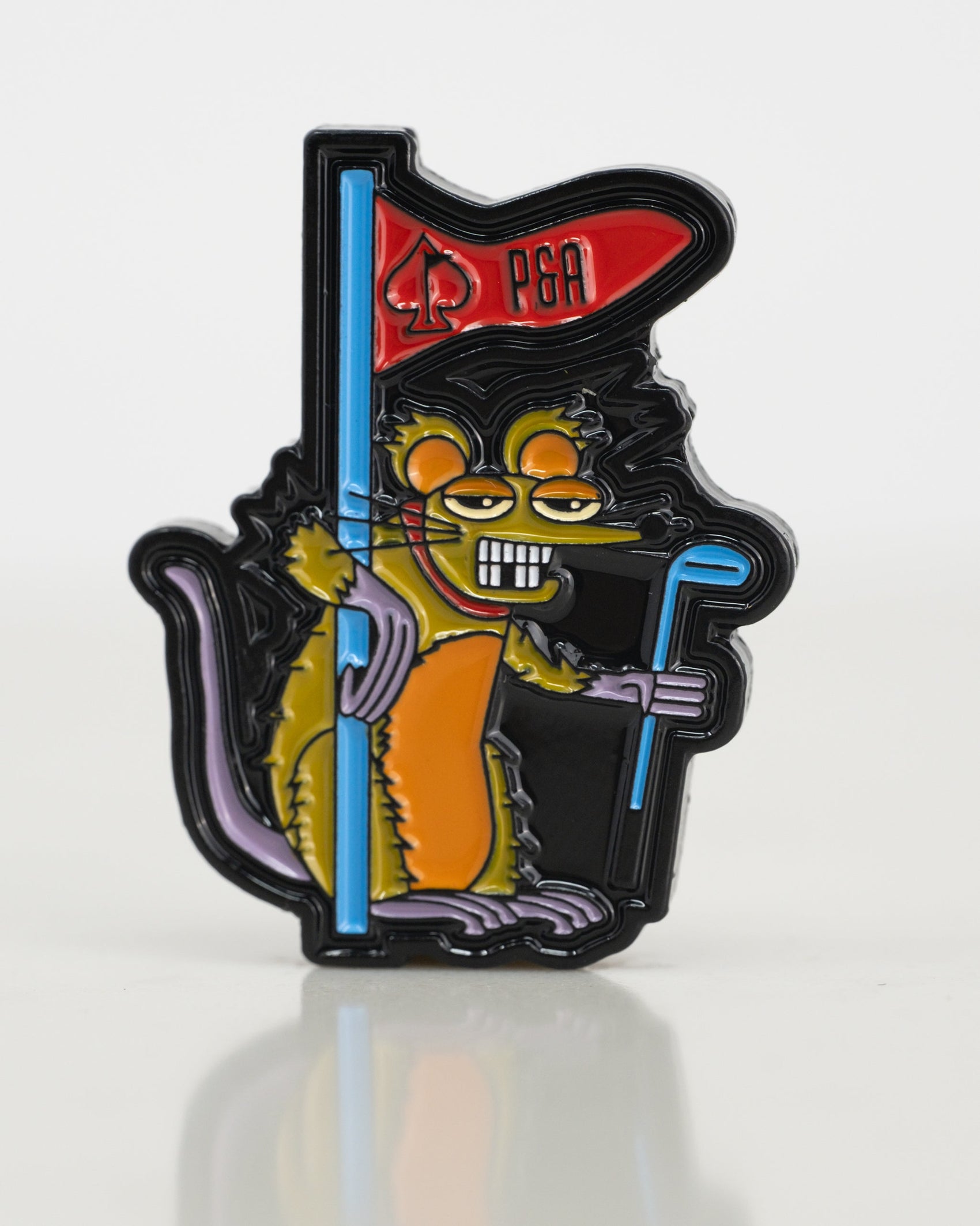 The Pins and Aces Range Rat Ball Marker features a yellow cartoon rat with orange and purple enamel accents, standing on two legs, holding a blue golf club and a red spade-flag with “P&A” text, sporting a mischievous expression.