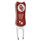 The Switchfix ACC College Switchfix Divot Tool with Ball Marker has a red and silver design, textured grip, Oklahoma Sooners OU logo, two metal prongs, gold-colored buttons, and a switchblade mechanism for easy use on the course.