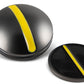 Two black circular One Rail Smooth Ball Markers from OnPointGolf.us, each with a yellow diagonal stripe—one is thicker and ridged for marking, the other is thinner and flat for use as a golf alignment tool or putting aid.