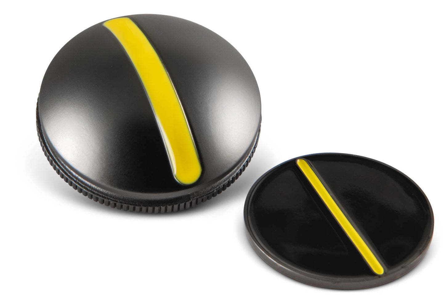 Two black circular One Rail Smooth Ball Markers from OnPointGolf.us, each with a yellow diagonal stripe—one is thicker and ridged for marking, the other is thinner and flat for use as a golf alignment tool or putting aid.