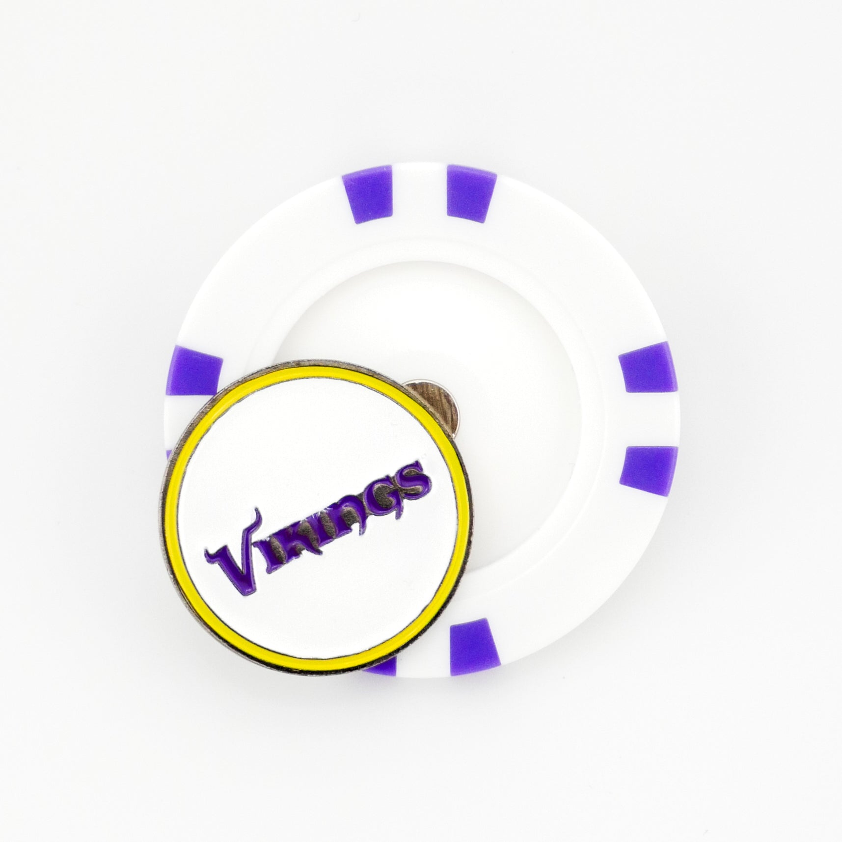 A white Ballmarkers.com poker chip ball marker with purple accents is on a white surface, topped by a round pin with a yellow border and stylized purple "Minnesota Vikings" text.