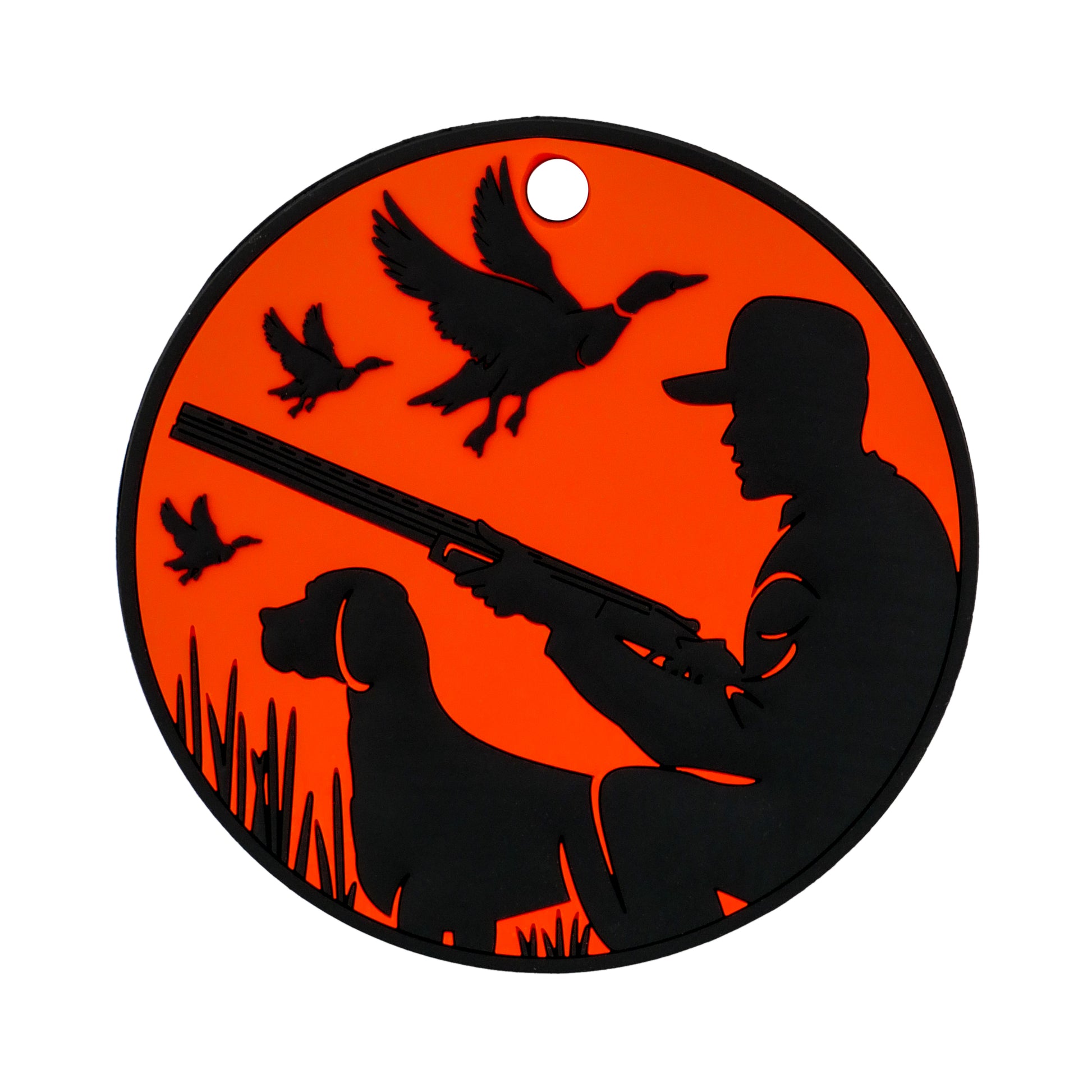 The Duck Hunter Putting Disk by Logie Joe's Golf features a round, orange and black design with a hunter, dog, and flying ducks—ideal as a unique putting aid or stylish accessory for golf enthusiasts.