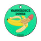 A round green Nannerdick Dunes Putting Disk by Logie Joe's Golf features a peeled banana resembling a penis, with "NANNERDICK DUNES" above and "LOGIE JOE'S" below, hinting at tricky golf strokes.