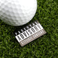 A white Parental Advisory golf ball by Logie Joe's Golf, featuring a black-and-white Explicit Content label, rests on artificial green grass—an eye-catching premium accessory for today’s golfer.