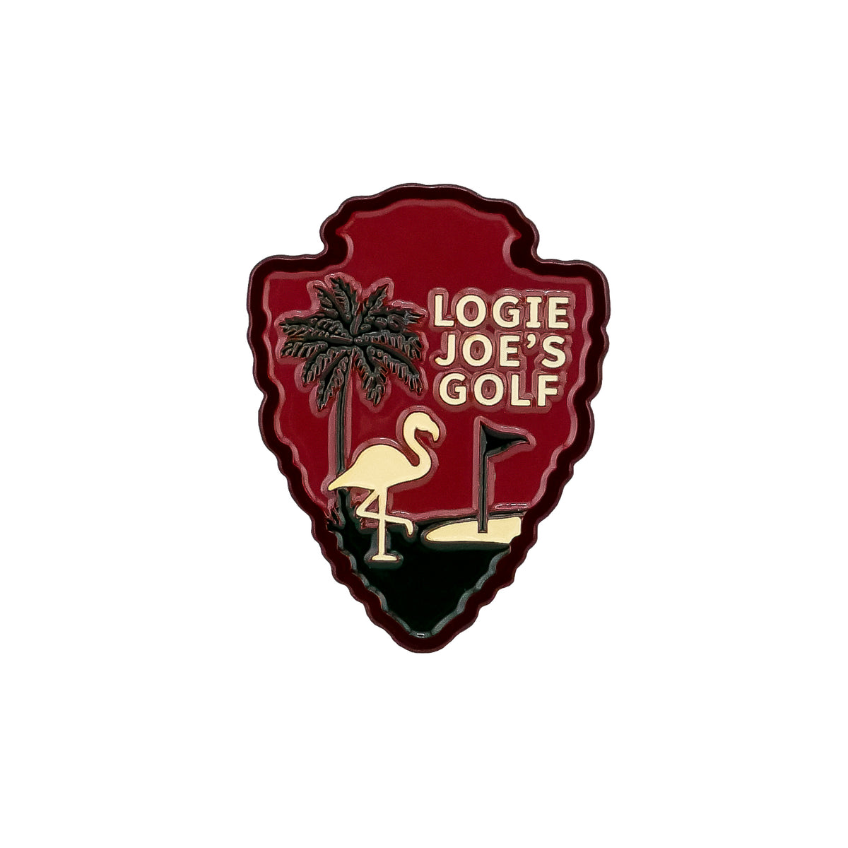 The Park Sign Arrowhead Ball Marker by Logie Joe’s Golf features a red badge with a palm tree, flamingo, golf hole, and cream branding—a standout golf accessory inspired by national park signs.