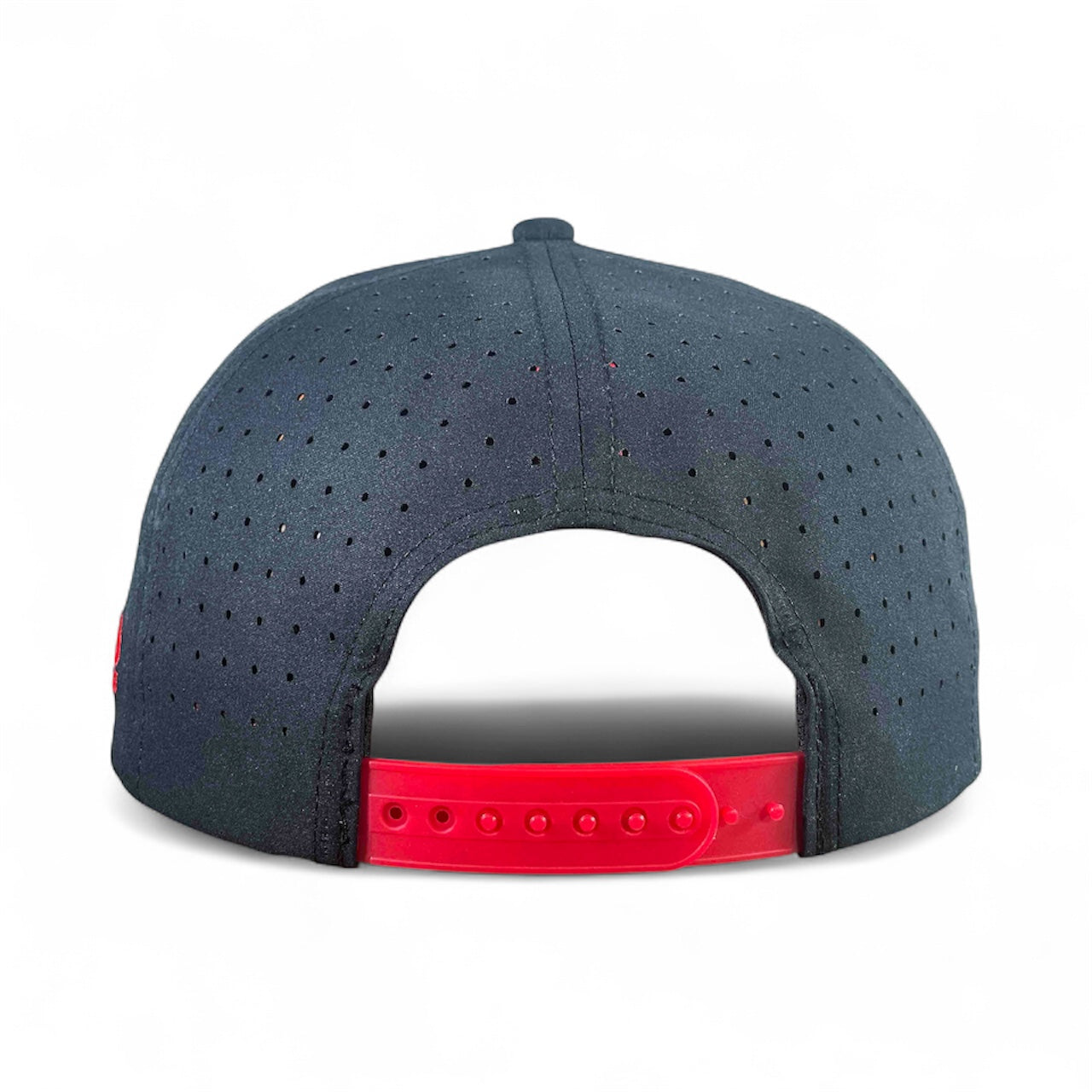 The Logie Joe's Golf Free Golf Balls Van Snapback Hat is a dark blue, perforated hat with an adjustable red snapback and matching ball marker, shown from the back on a plain white background—sporty and perfect for golfers.
