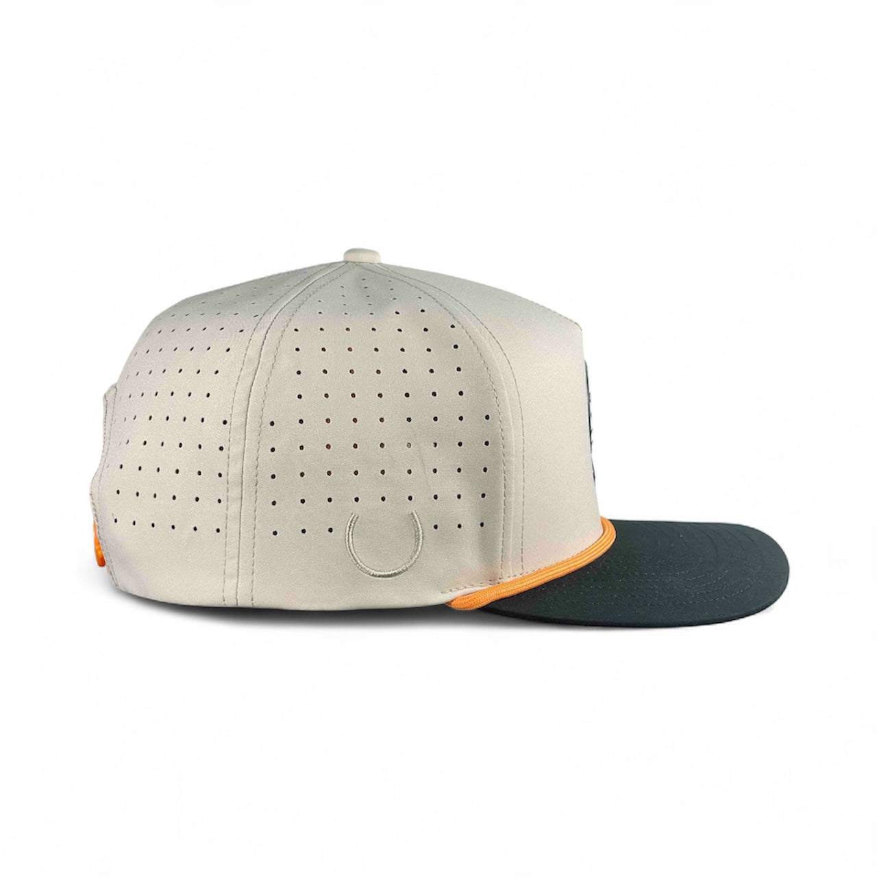 The Logie Joe's Golf Breakfast Ball Snapback Hat features a beige design with small ventilation holes, an orange-accented visor edge, black bill, subtle horseshoe logo, and a built-in magnet with a matching ball marker.