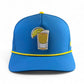 Logie Joe's Golf Tequila and Lime Golf Hat: blue snapback cap with yellow-trimmed brim, shot glass graphic, built-in magnetic ball marker holder (marker included), and adjustable fit—stylish headwear for any occasion.