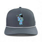 The Logie Joe's Golf Astronaut Walker Golf Hat is a dark gray snapback cap featuring a colorful cartoon astronaut with a green plant, plus a built-in magnetic ball marker holder and included marker—great for golf or casual wear.