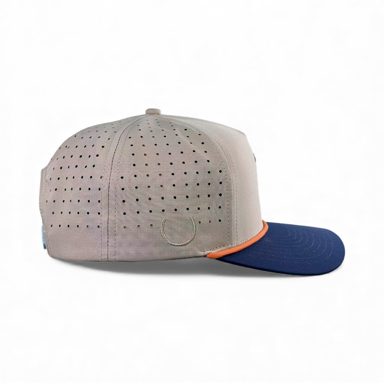 Logie Joe's Golf Tiki Bear Golf Hat is a light gray adjustable snapback cap with multicolor accents, small ventilation holes, orange lining above the dark blue flat brim, and a built-in magnetic ball marker holder. Shown in side profile on white.