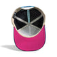 The image shows the inside of the Logie Joe's Golf Tiki Bear Snapback Cap with a pink brim, black and white polka dot lining, beige edges, LEADERS and MAKE YOUR MARK labels, and a built-in magnetic ball marker holder with marker.
