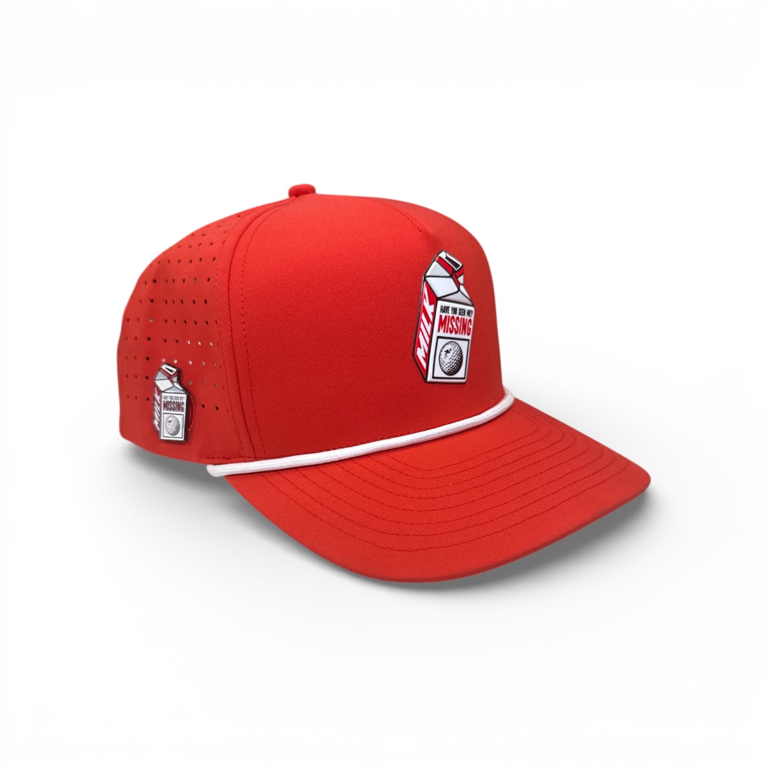The Logie Joe's Golf Missing Milk Golf Hat is a bright red snapback cap with two MISSING milk carton patches, built-in magnetic ball marker holder (marker included), small ventilation holes, and an adjustable fit.