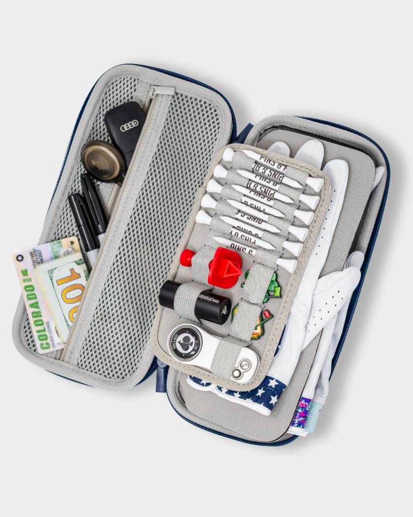 The Pins and Aces Glove & Accessory Caddie - Navy is a sleek open travel case that keeps golf essentials like pens, car keys, cash, gloves, tees, ball markers, and more organized in mesh and elastic compartments.
