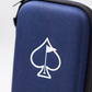 A close-up of the Pins and Aces Glove & Accessory Caddie - Navy, a zippered golf gear organizer featuring a white spade with a flag in the center, set against a plain light background.