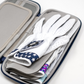 The Pins and Aces Glove & Accessory Caddie - Navy holds several white golf gloves, with one glove on top featuring a dark blue star pattern on the wrist.