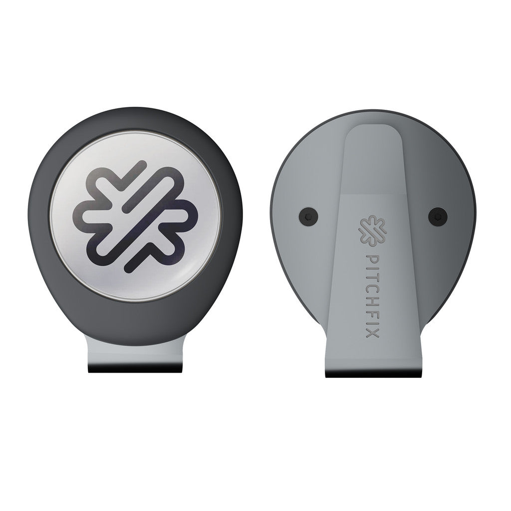 Two views of the PitchFix Hat Clip, a round gray and black golf ball marker with a leaf logo on the front and PITCHFIX engraved on the back—ideal as a giveaway for golf events.