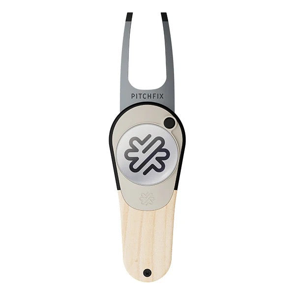 The PitchFix Woodie Divot Tool by PitchFix features a wood-effect handle, a circular center with a black and white logo, and "Pitchfix" near the prongs—an elegant choice for any golfer.