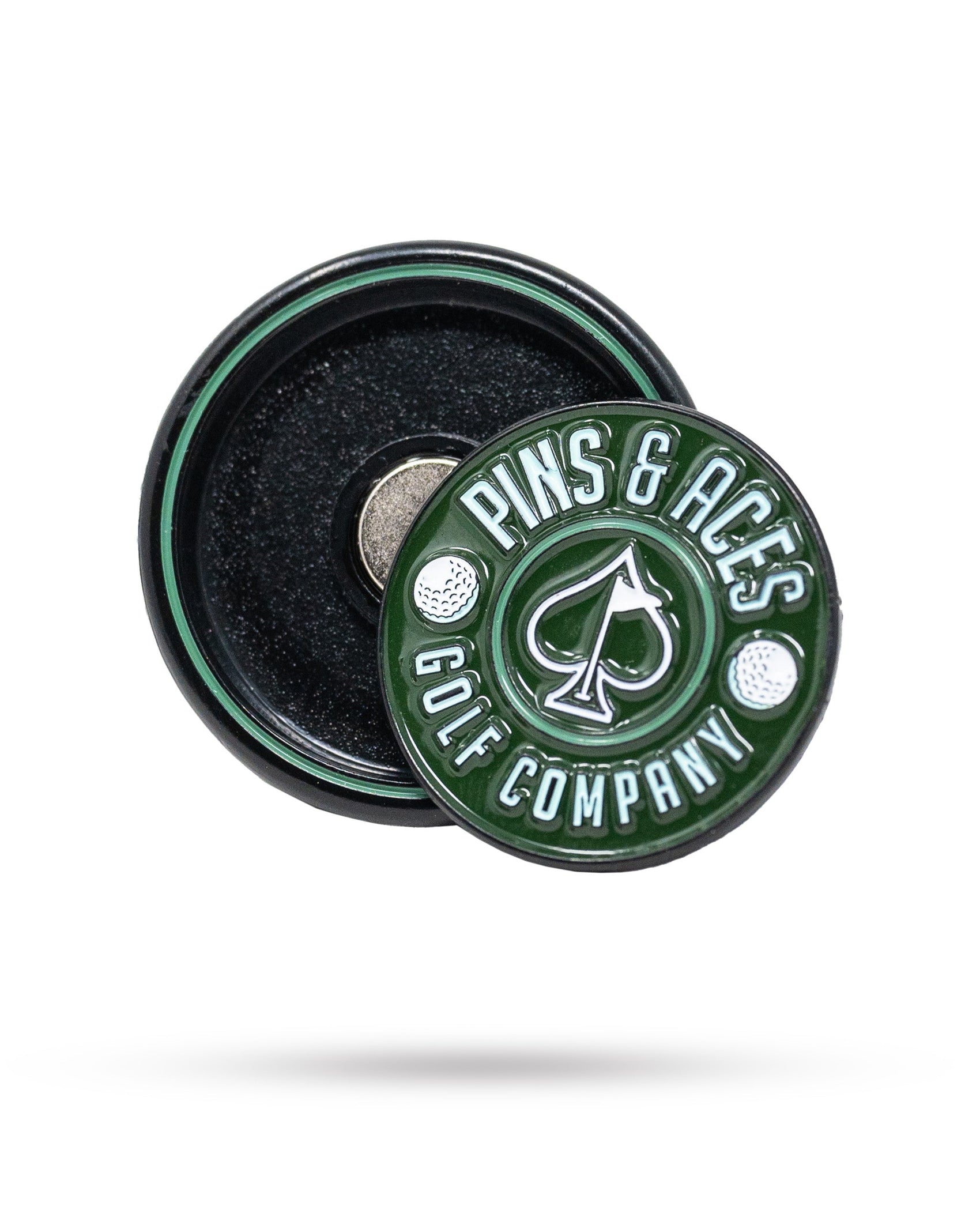 The Pop Out Medallion Ball Marker - Green by Pins and Aces features an ace of spades symbol, shown atop its magnetic black and green base—a stylish golf accessory for any player.