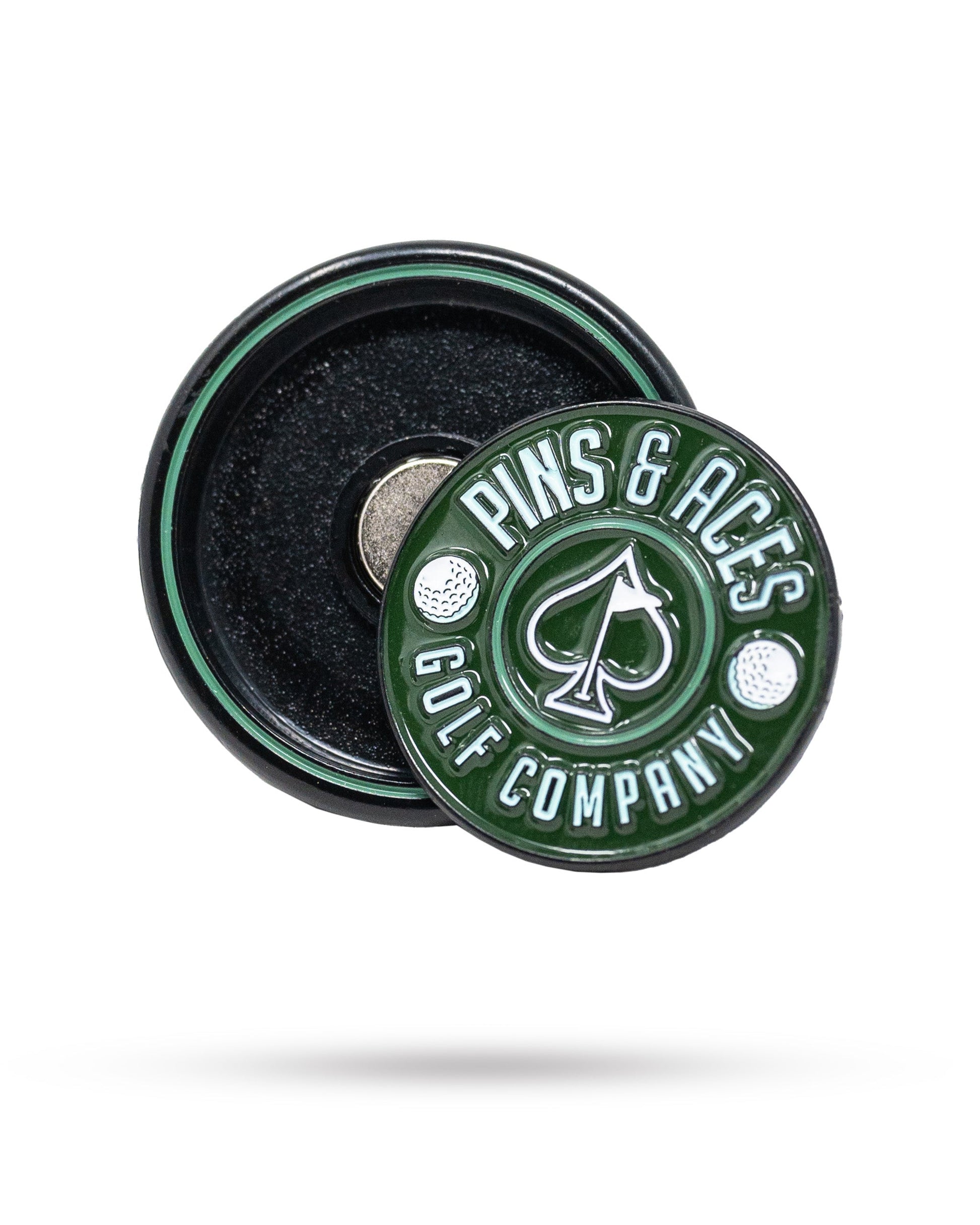 The Pop Out Medallion Ball Marker - Green by Pins and Aces features an ace of spades symbol, shown atop its magnetic black and green base—a stylish golf accessory for any player.
