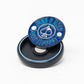 The Pop Out Medallion Ball Marker - Navy by Pins and Aces is a slim blue and silver magnetic marker, shown upright with two golf balls on a small black circular case.