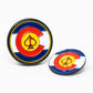 The Pins and Aces Pop Out Medallion Ball Marker - Colorado features two round markers with a Colorado flag design, including a yellow spade inside a red "C" on blue, white, and red backgrounds—one upright, one flat.